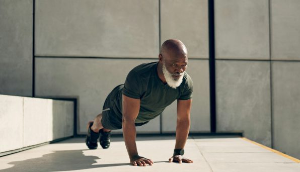 Mature, man and fitness for exercise with pushup for strength, health or wellness by outside. Afric